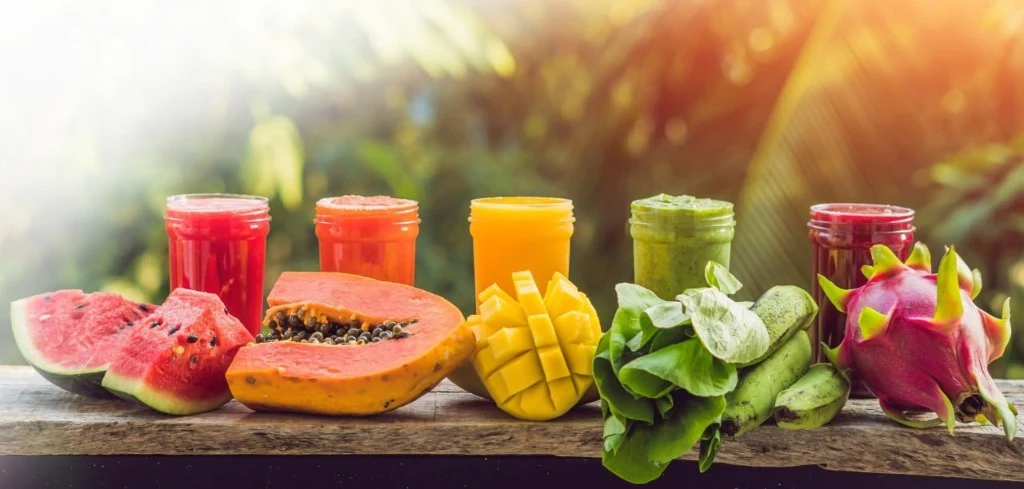 Fresh fruit and vegetable smoothies with tropical fruits